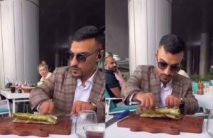 Boef gespot terwijl hij aan het bijbeunen is als ober in restaurant