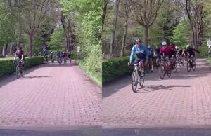 Grote groep wielrenners eist complete weg op, automobilist weigert te remmen